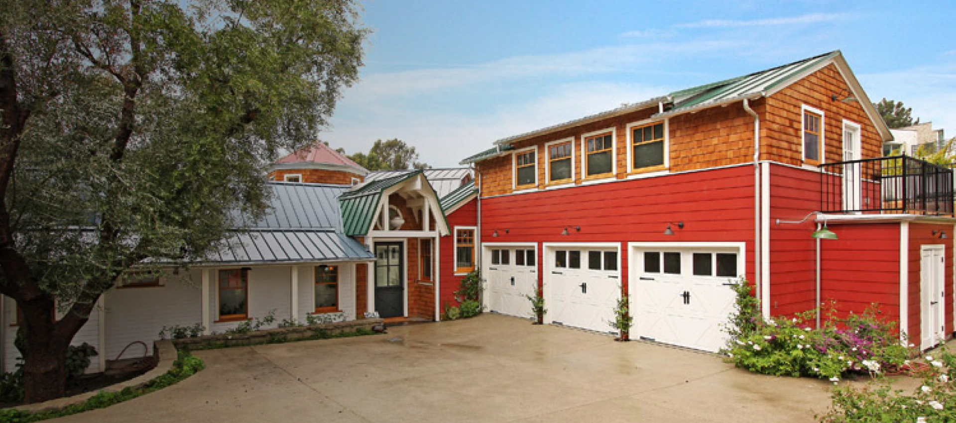 exterior view of a house with 3 doors garage